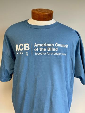 Front view of ACB Authentic T-Shirt in denim blue with white logo 